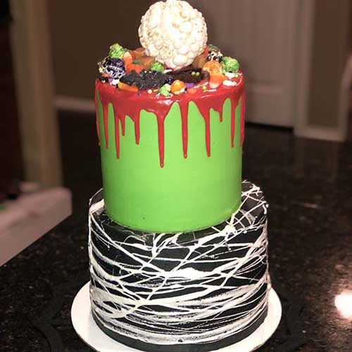 halloween spider web cake with red chocolate drizzle